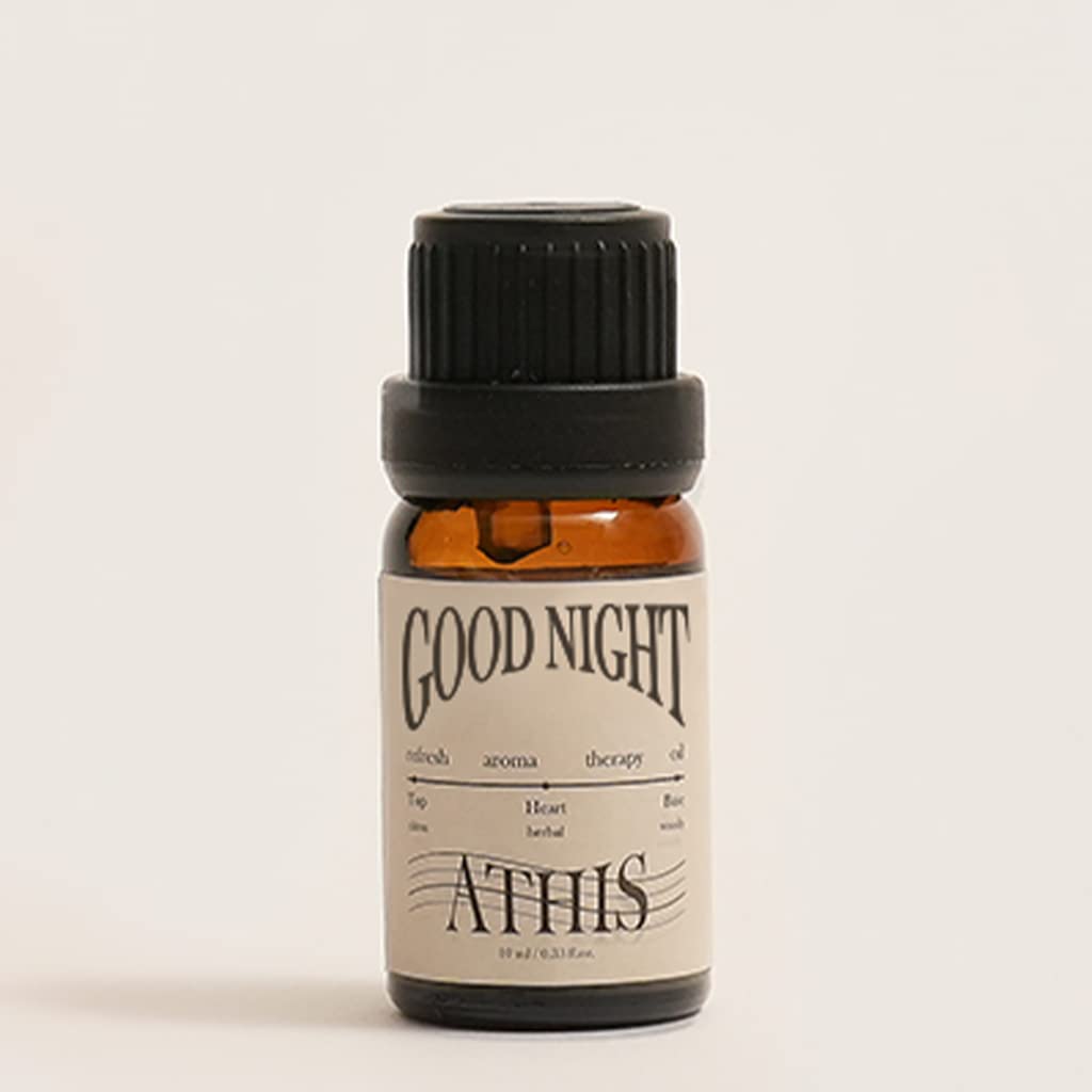 Athis Organic Essential Oil Blends bottle pour, energizing aroma for a refreshed morning.