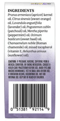 Aura Cacia Chill Pill Roll-On aplicado en el pulso para calma