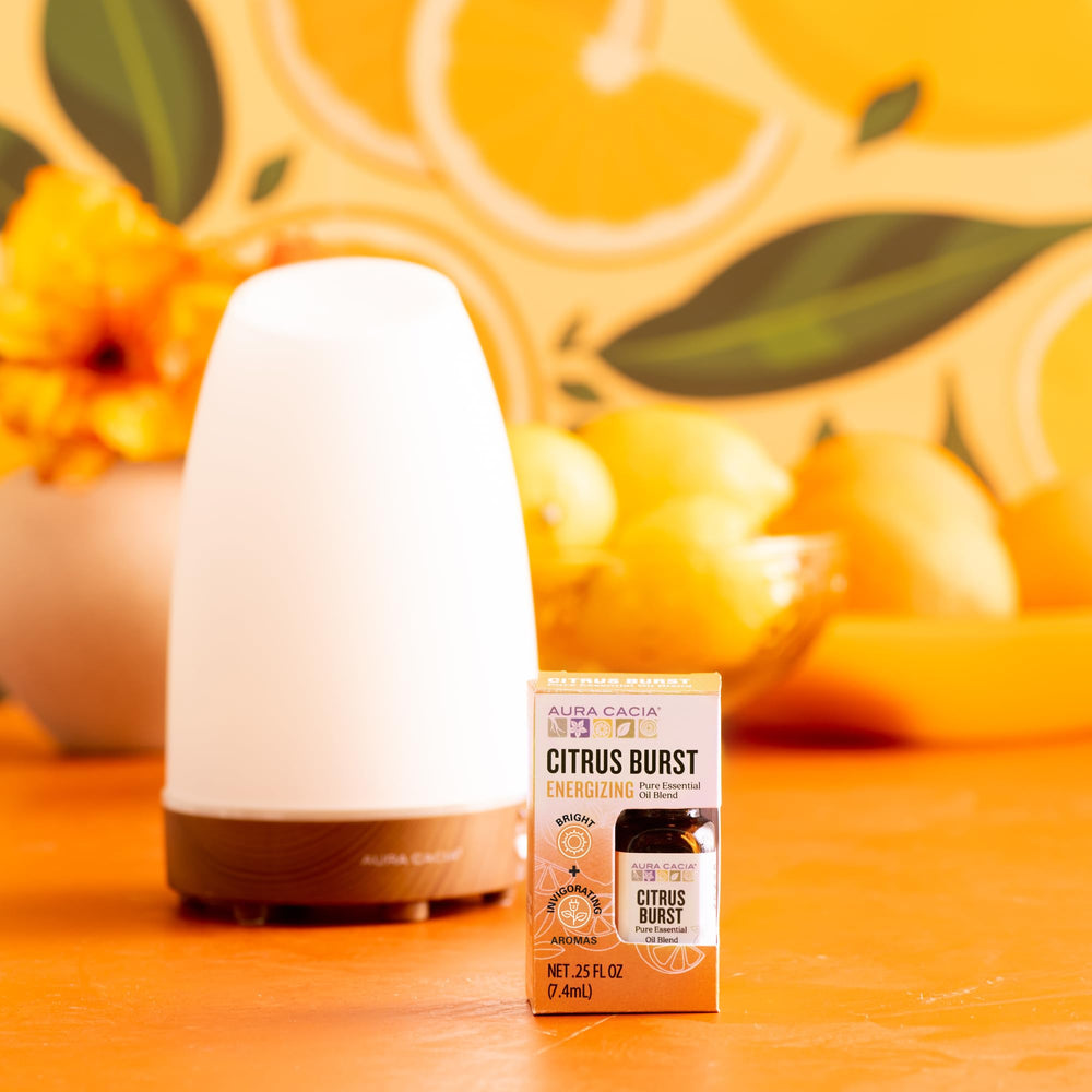 Aura Cacia Citrus Burst drops measured for easy diffuser dilution