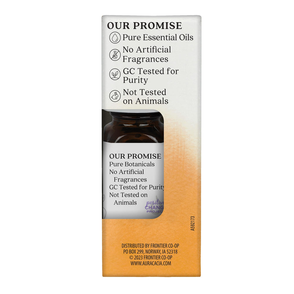 Aura Cacia Citrus Burst glass bottle bathed in natural light