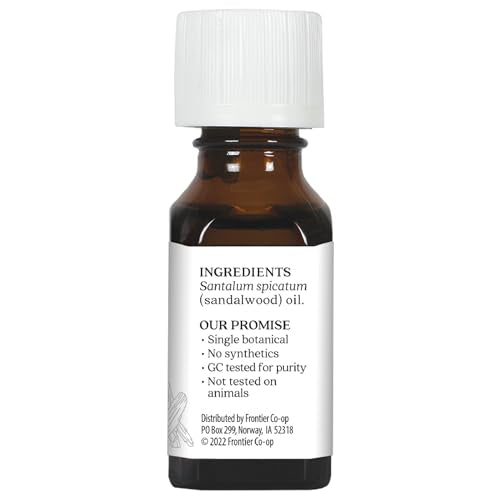 Aura Cacia Sandalwood essential oil drops for scalp massage and skincare.