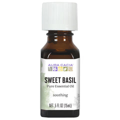 Aura Cacia Sweet Basil oil bottle pour for a refreshing diffuser aroma.