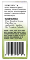 Applying Aura Cacia Tea Tree Roll-On on skin for targeted refresh