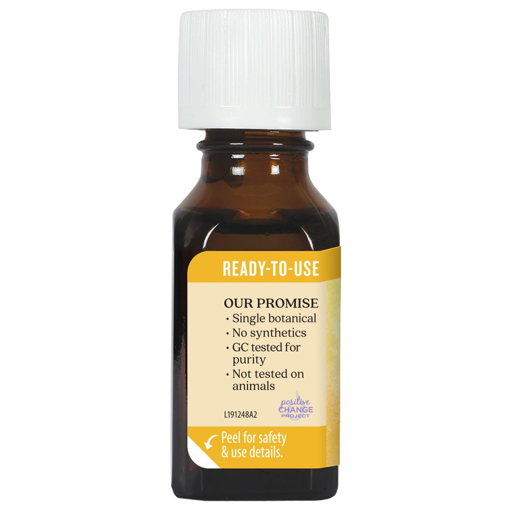 Aura Cacia Buddha Wood oil in amber bottle supports mindful use.