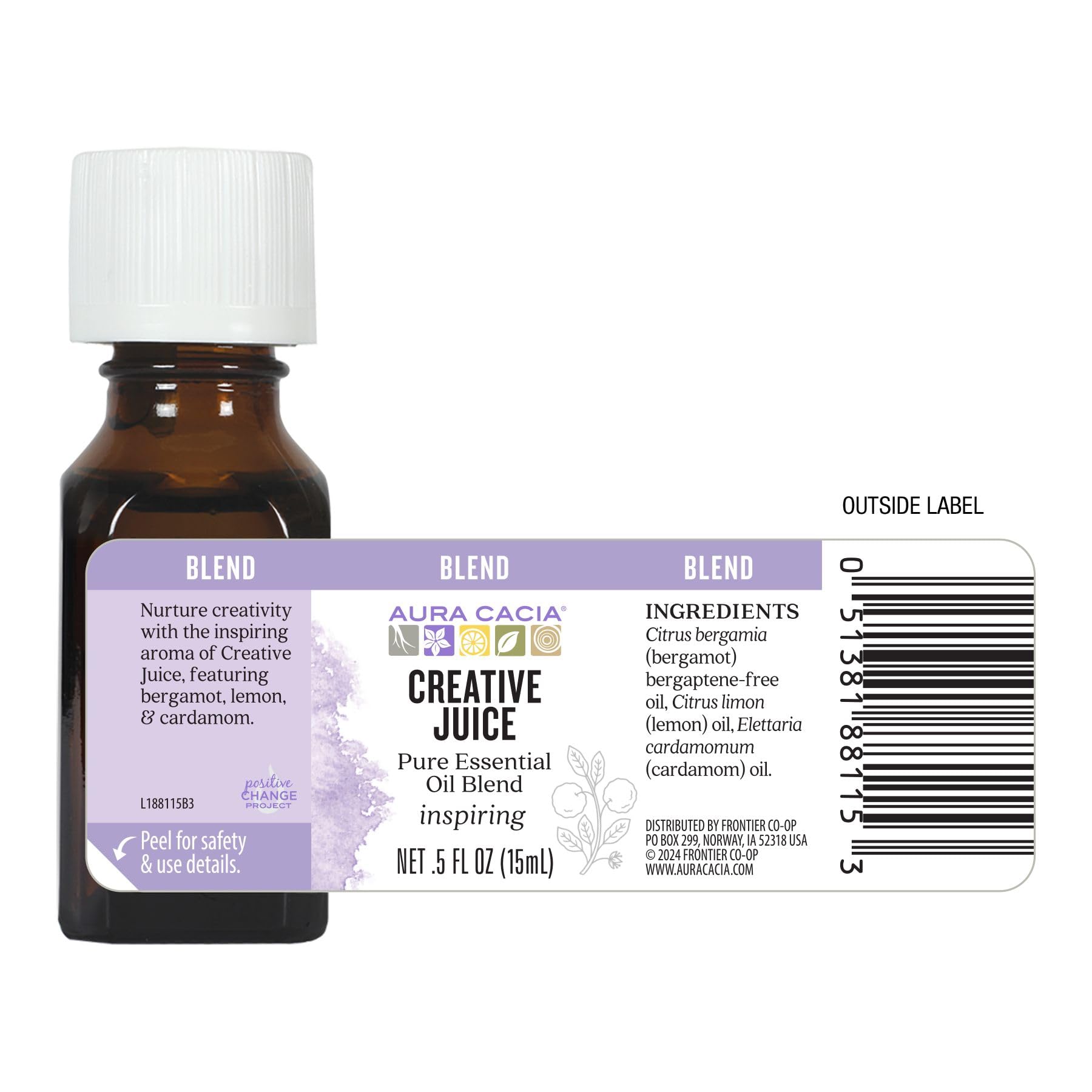Aura Cacia Creative Juice bottle on desk enhances ambient, natural fragrance.