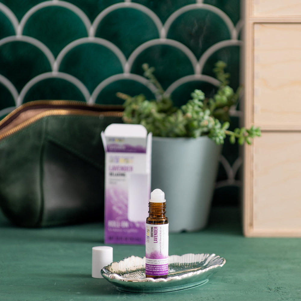 Aura Cacia Lavender Roll-On close-up showing apricot kernel oil and Vitamin E for skin nourishment.