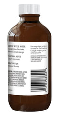 Aura Cacia peppermint oil label closeup highlighting GC/MS purity testing.