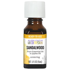 Aura Cacia sandalwood in jojoba oil bottle ready for quick skin care.
