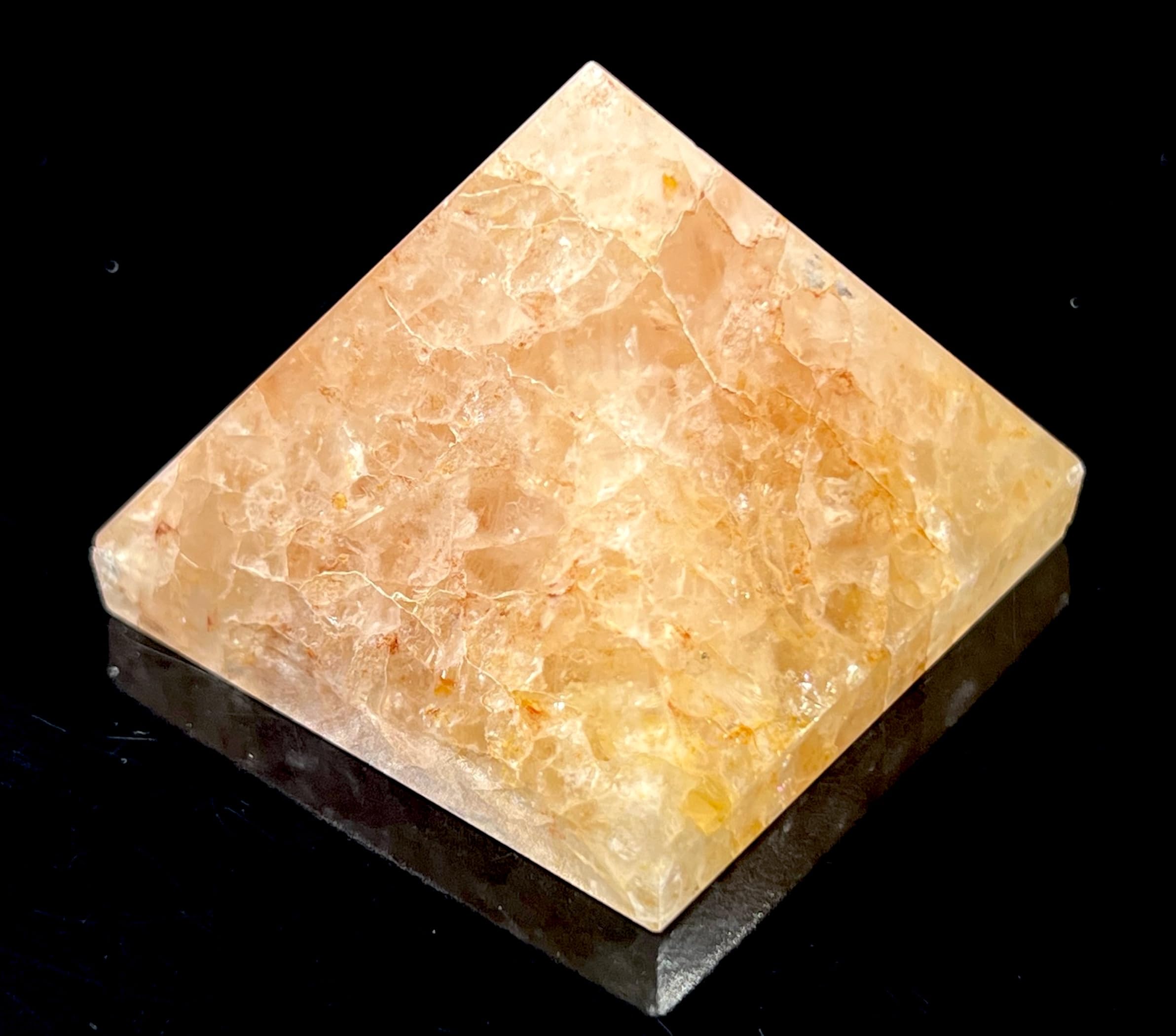 Awaken Your Kundalini yellow quartz pyramid used in meditations for inner clarity.
