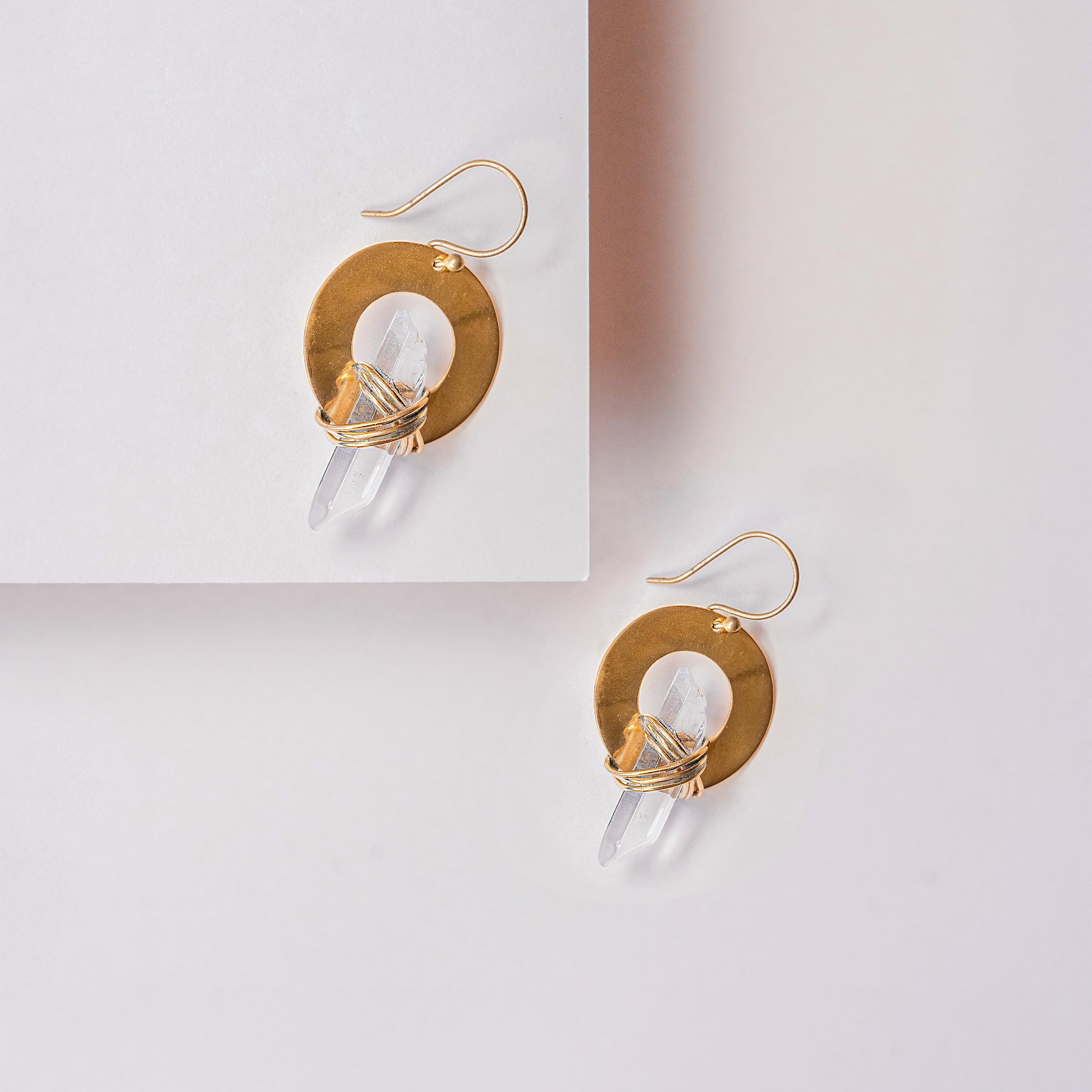 Ayana Crystals handmade earrings with golden wrap and clear quartz—distinctive look.