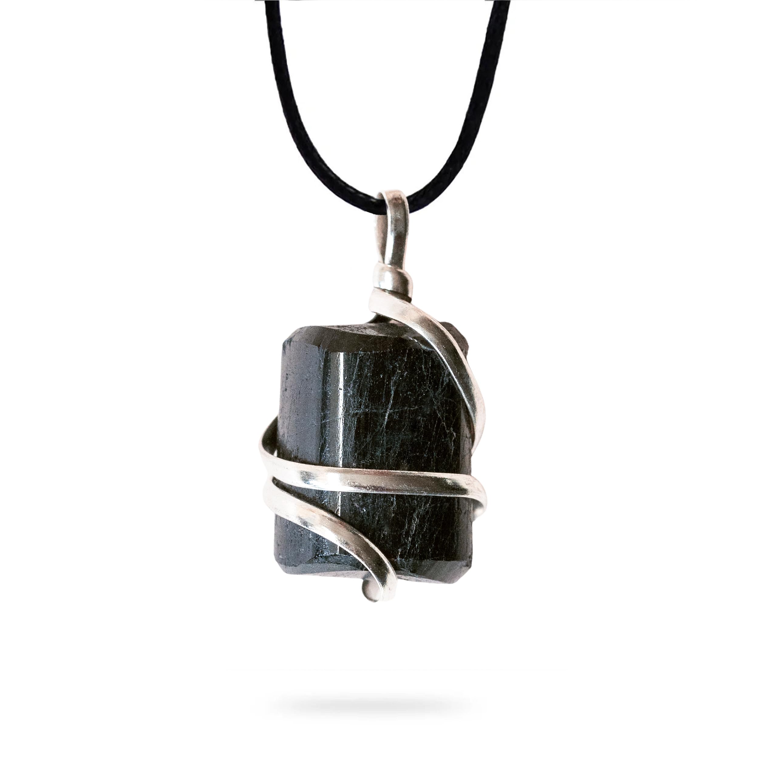 Ayana Wellness raw black tourmaline pendant close-up for grounding.