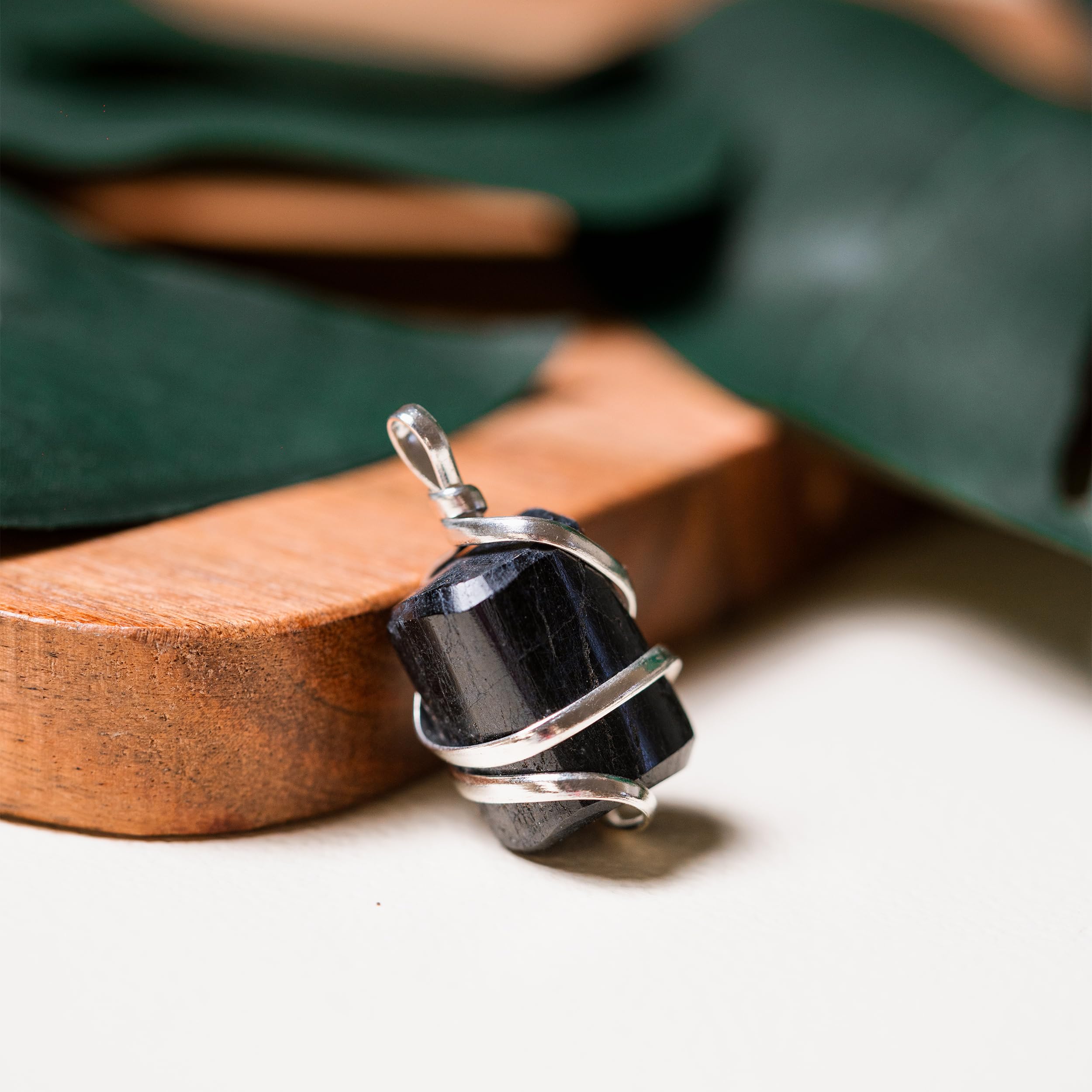 Ayana tourmaline pendant worn on neck with adjustable vegan cord.