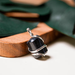 Ayana tourmaline pendant worn on neck with adjustable vegan cord.
