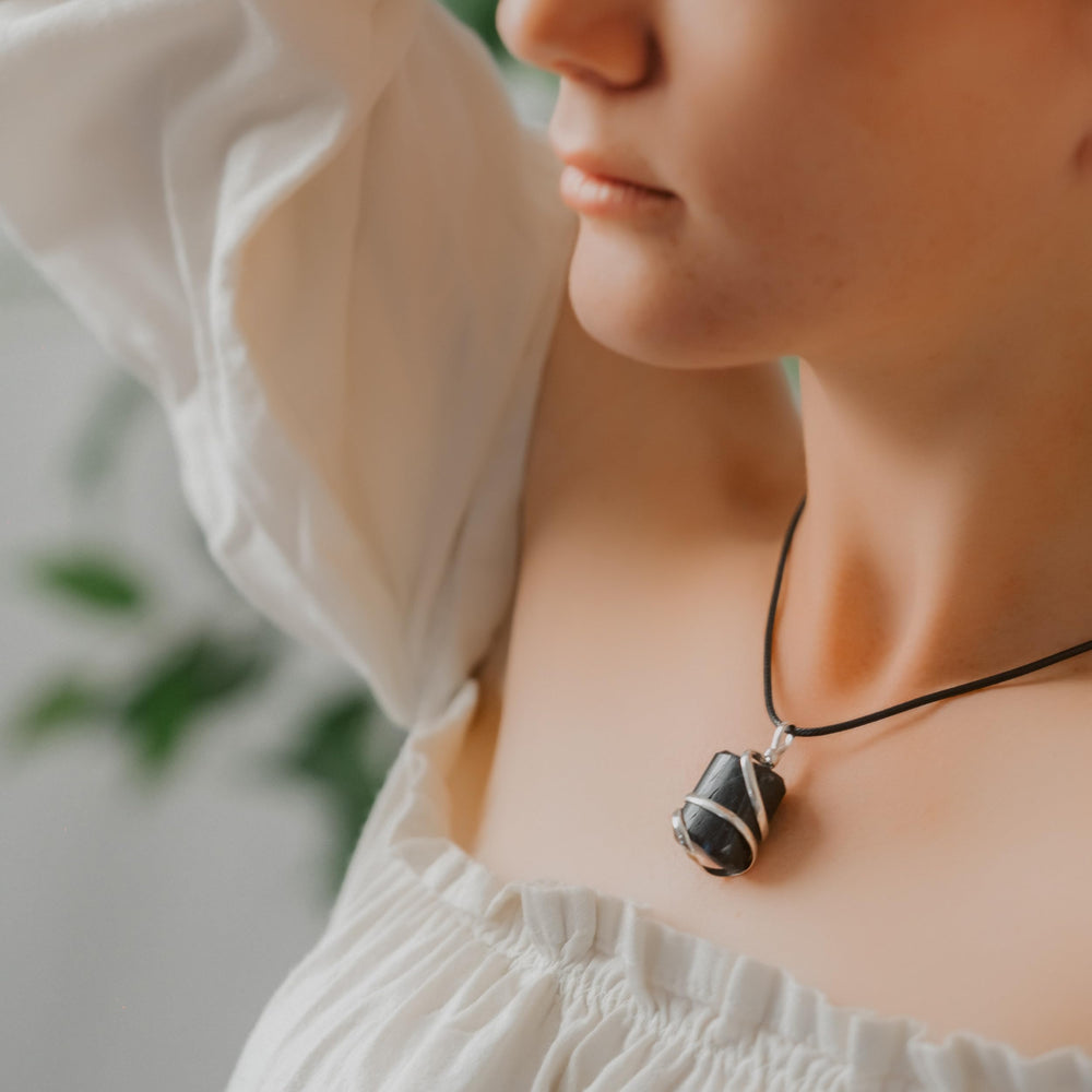 Ayana wrapped crystal tumble stone emphasizing authentic craftsmanship.