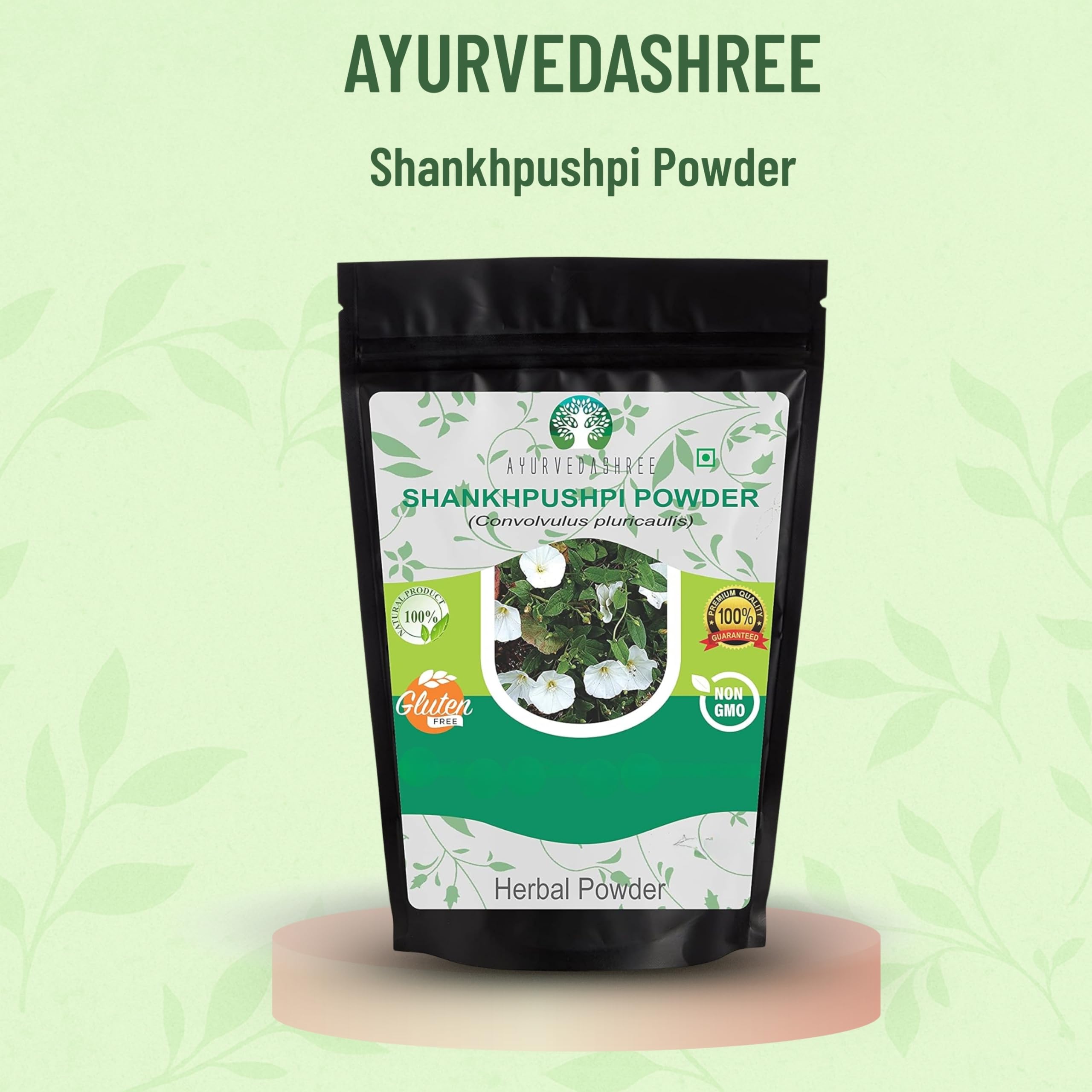Ayurvedashree Shankhpushpi powder label detail emphasizing vegan, non-GMO attributes.