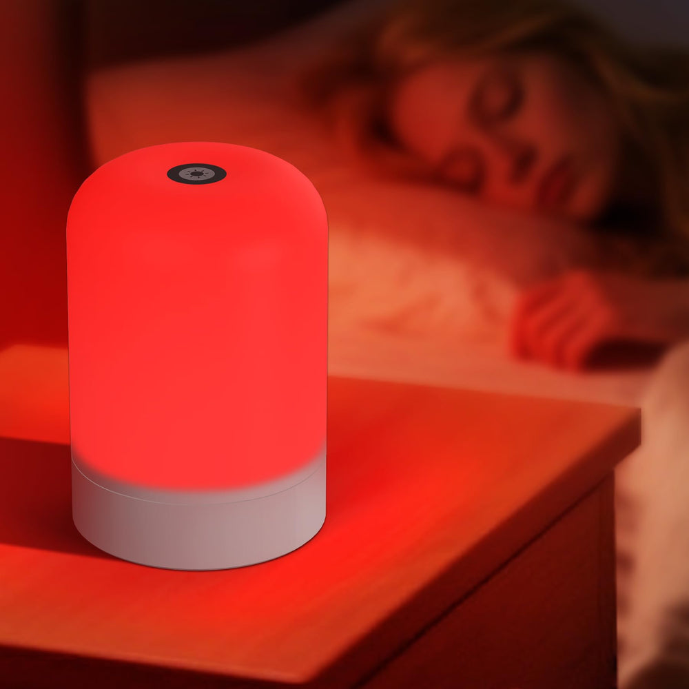 Azhien red light therapy lamp on a bedside table provides a soothing evening glow.