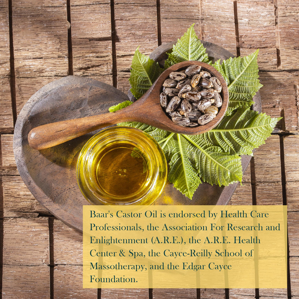 Hand applying Baar Palma Christos Oil for skin or hair nourishment.