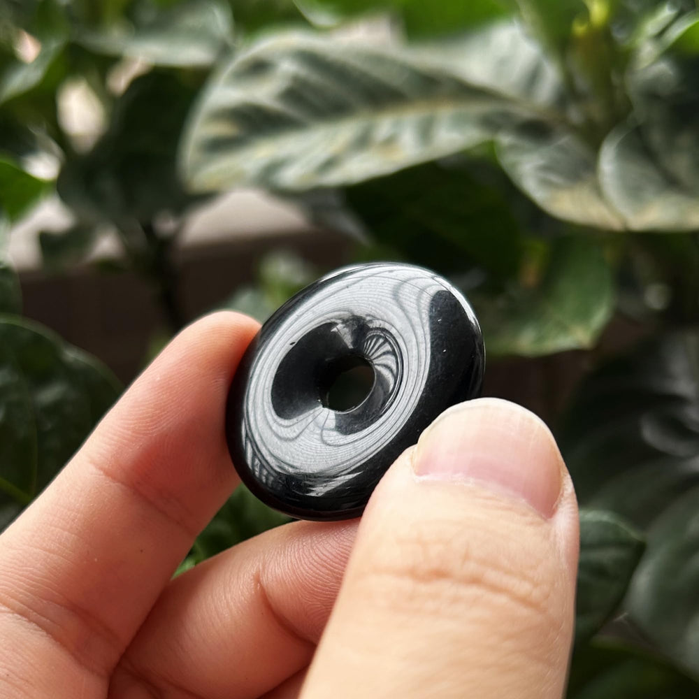 Bacatgem obsidian donut pendant close-up showing polished surface
