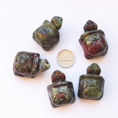 Bacatgem dragon blood jasper tortoise figurine, close-up, showcases unique stone grain and natural pattern.