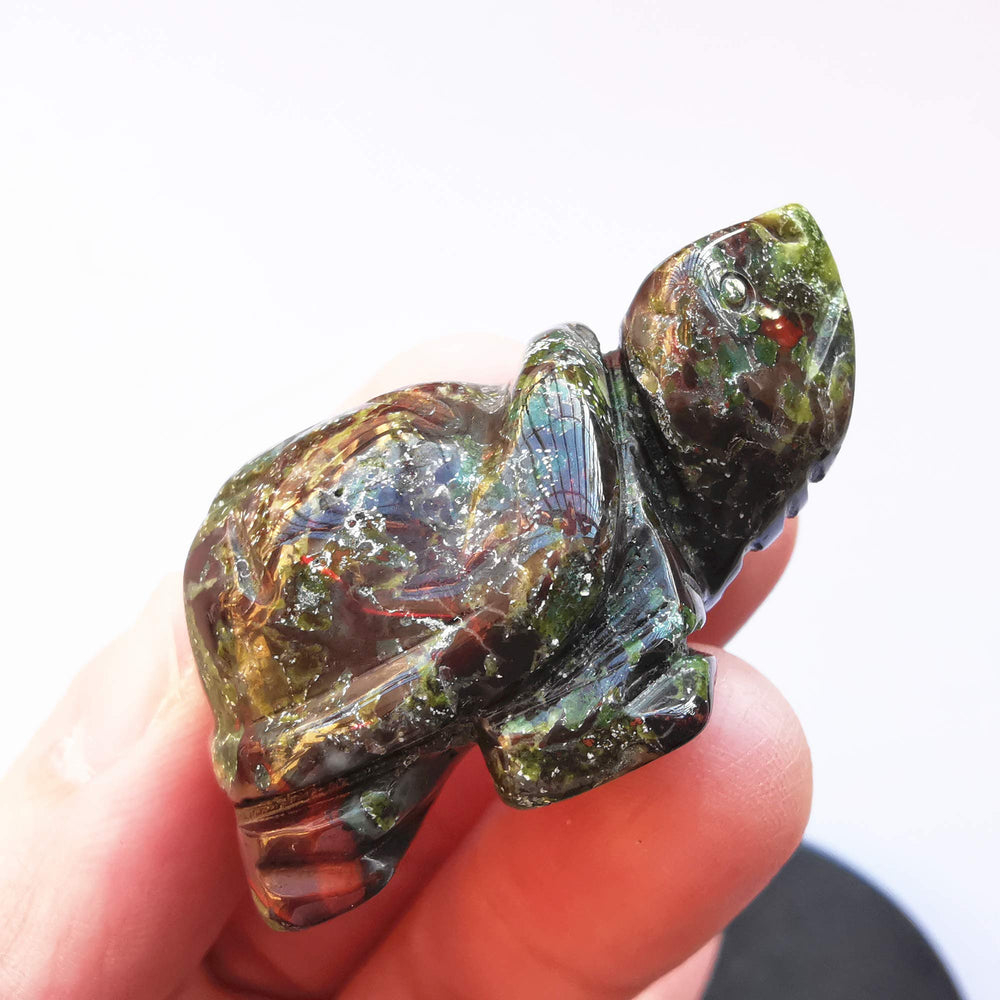 Bacatgem dragon blood jasper tortoise figurine, side view, ideal for desk or shelf placement.