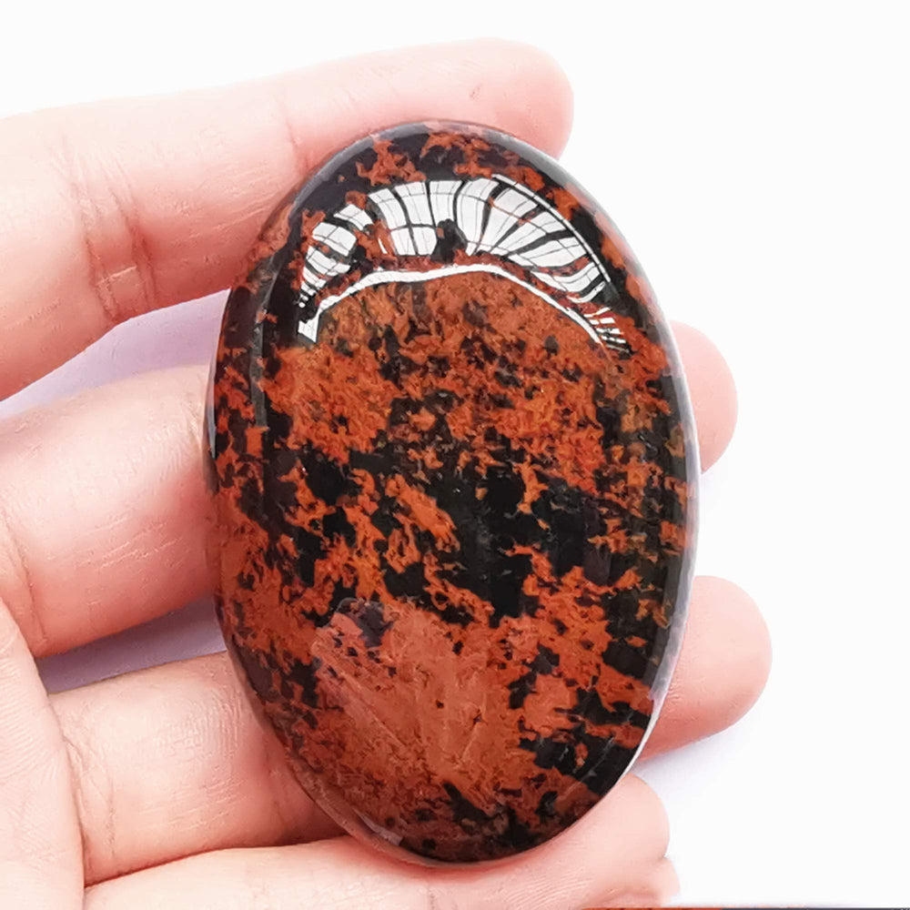 Bacatgem golden swan oval worry stone held in hand for stress relief and relaxation