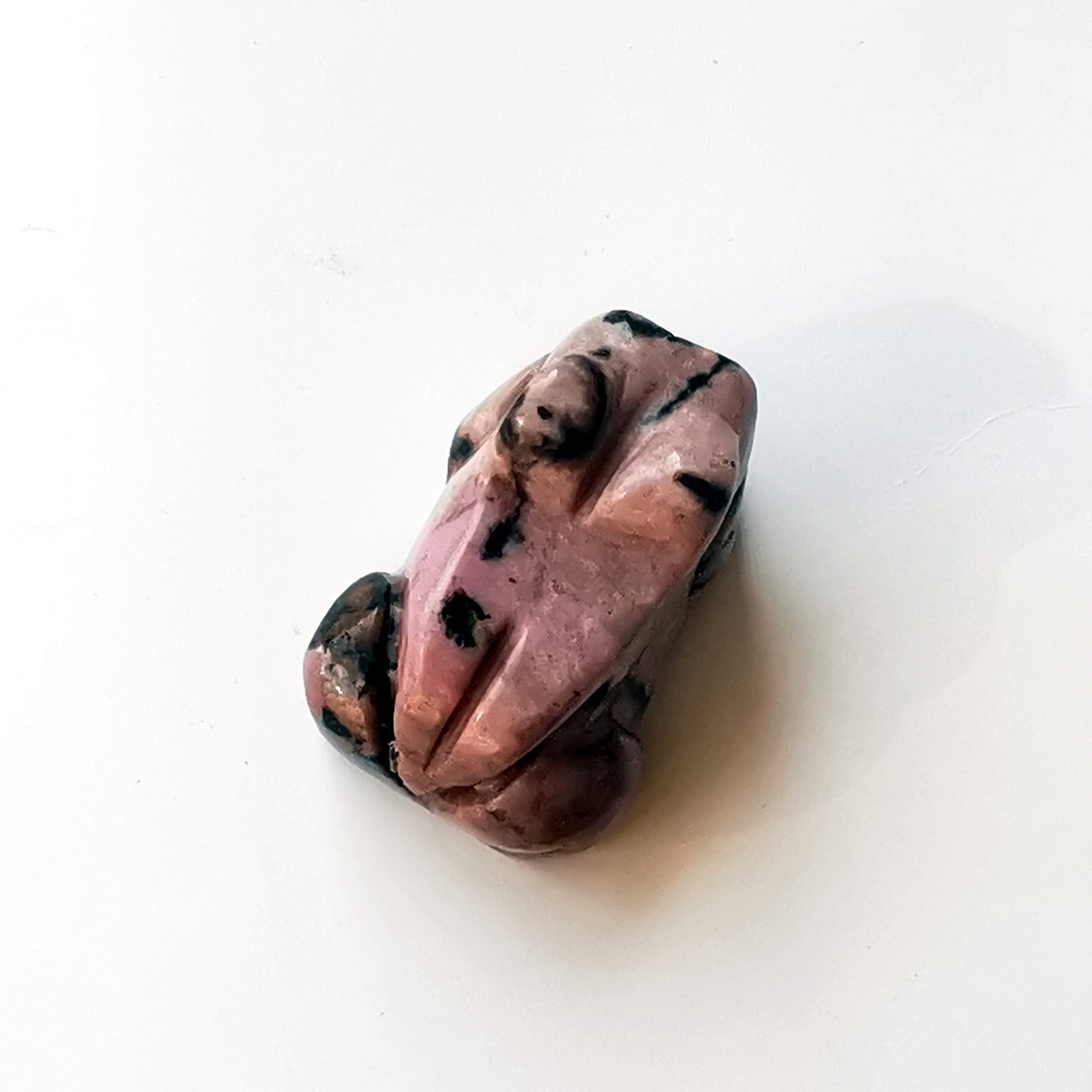 Bacatgem natural stone frog figurine placed on a desk for calm focus.