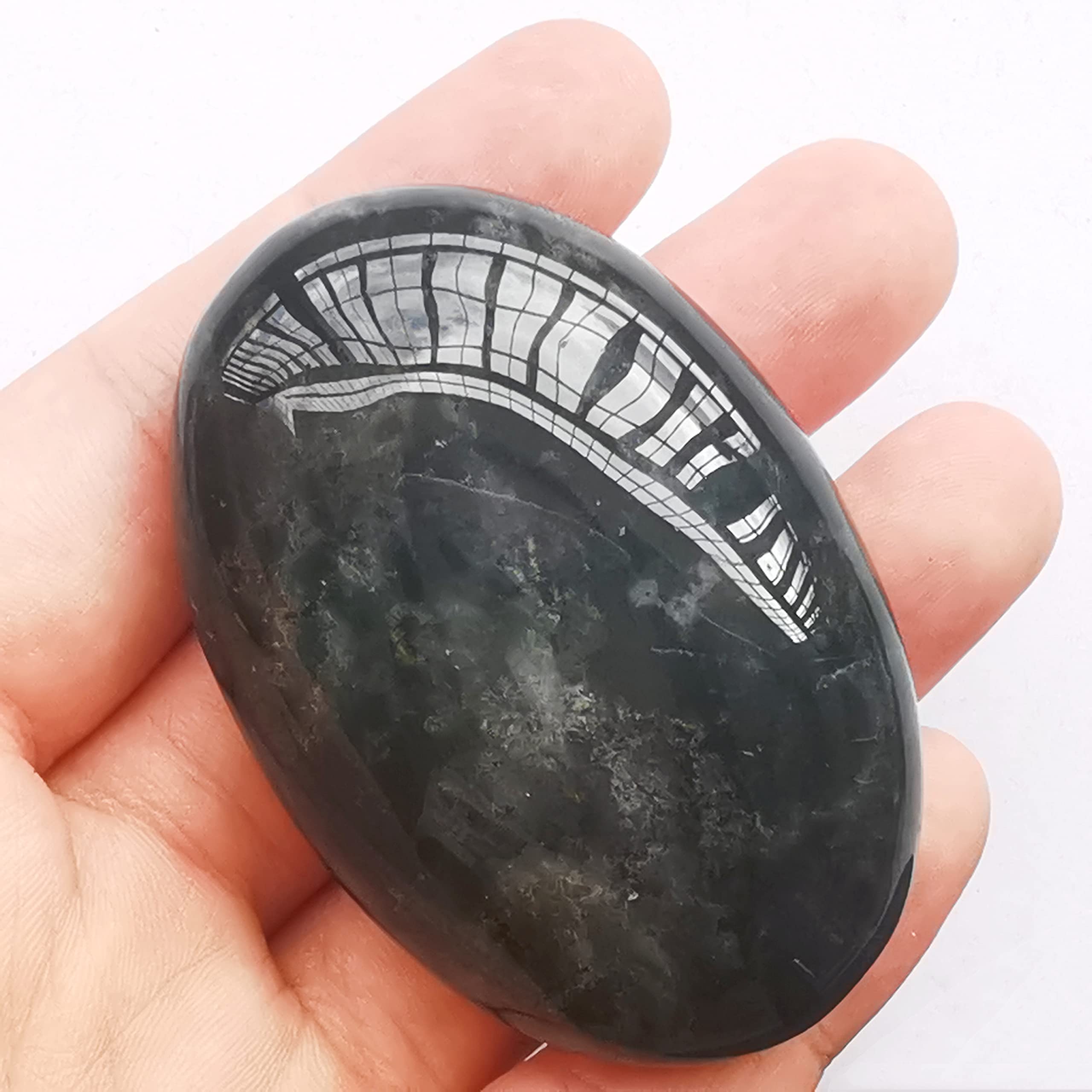 Bacatgem palm stone during spa massage promotes relaxation and mindful breathing.
