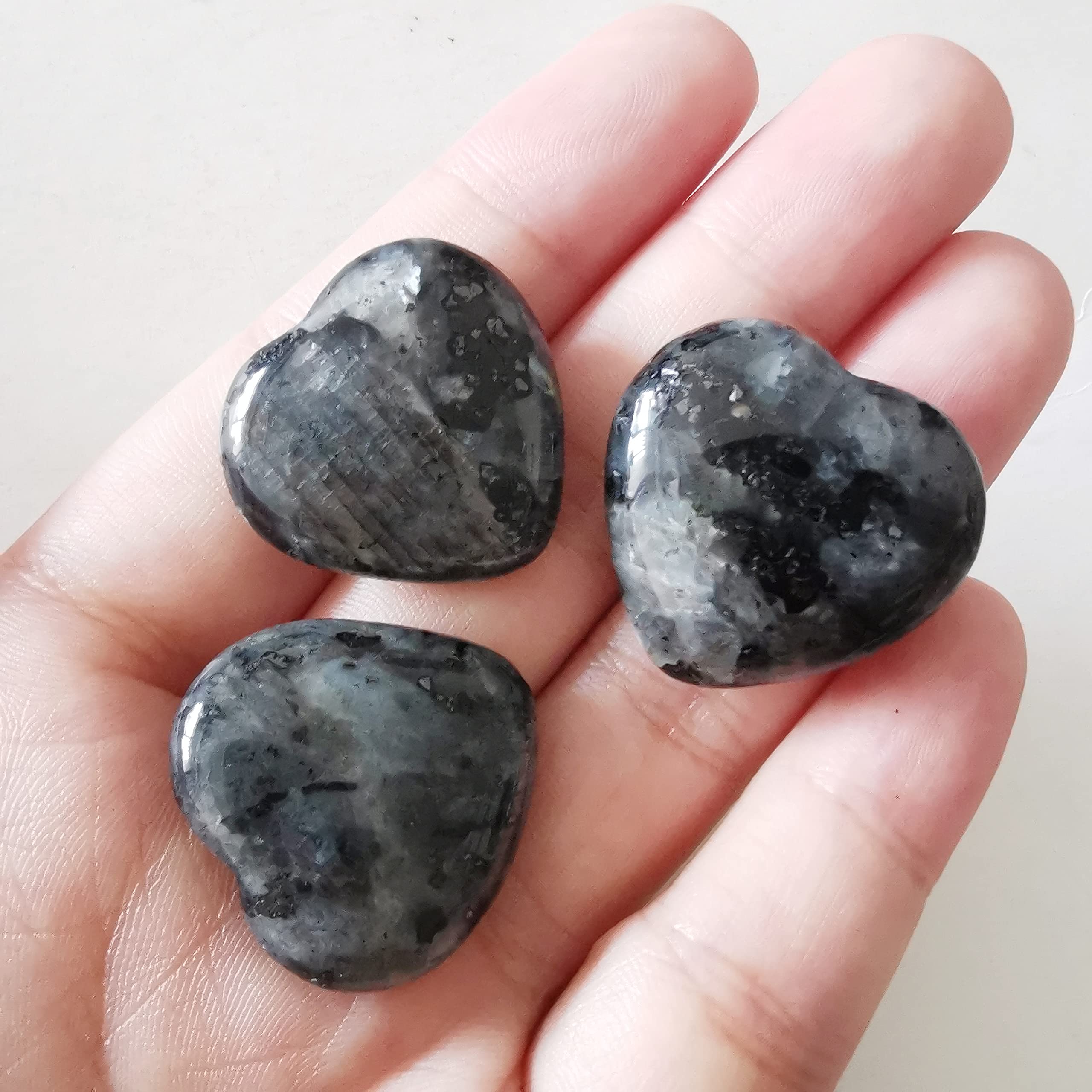 Bacatgem pocket heart worry stone close-up for Reiki and chakra cleansing rituals.