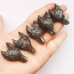 Bacatgem wolf head gemstone close-up showing natural patterns, perfect for handmade jewelry.