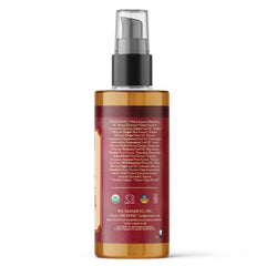 Badger Ginger Massage Oil label detail highlighting organic ingredients and warming aroma.