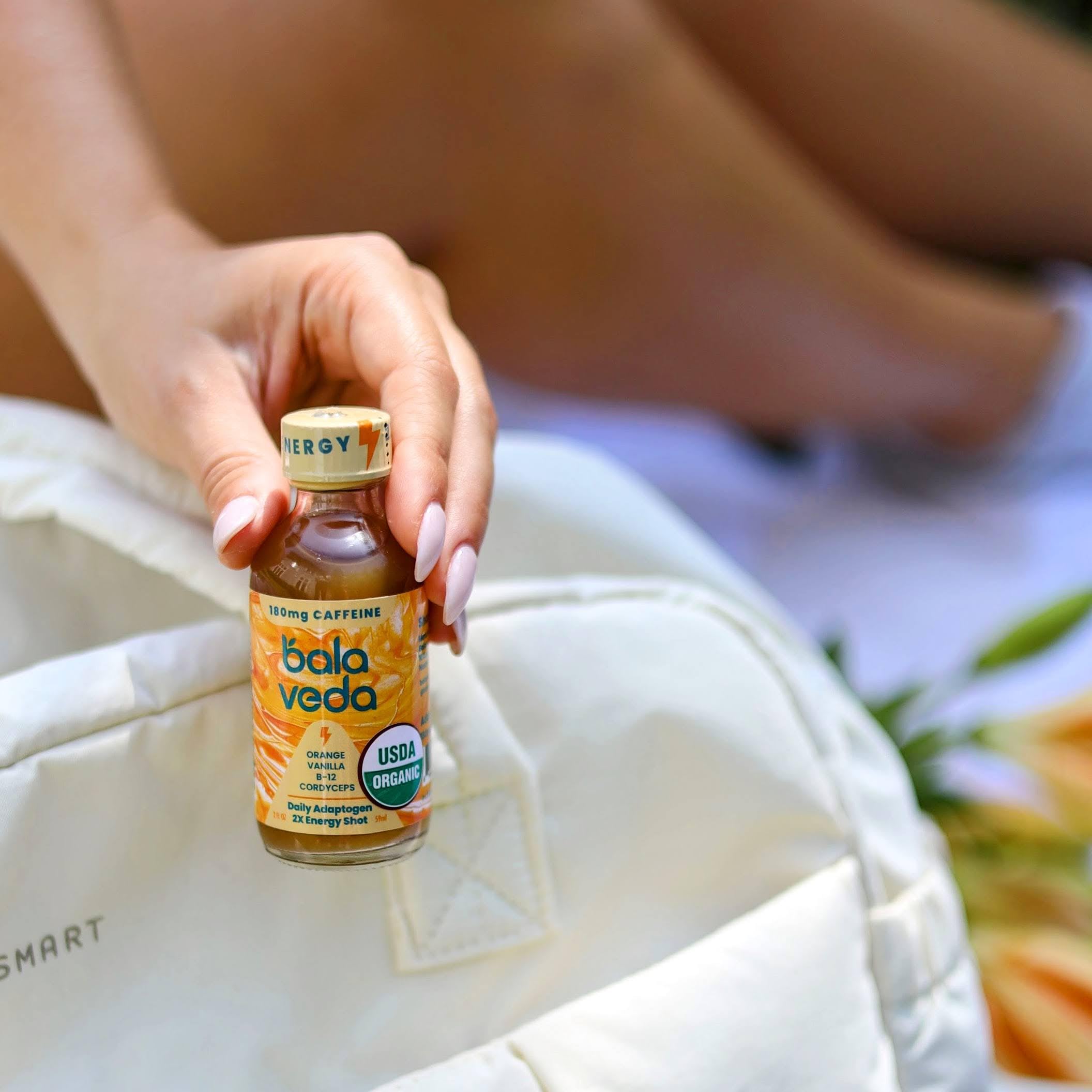 Balaveda Supersonic Citrus glass packaging emphasizes sustainability and vegan ingredients.