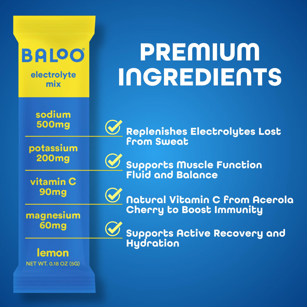 Baloo orange packets beside water for on-the-go, sugar-free hydration.