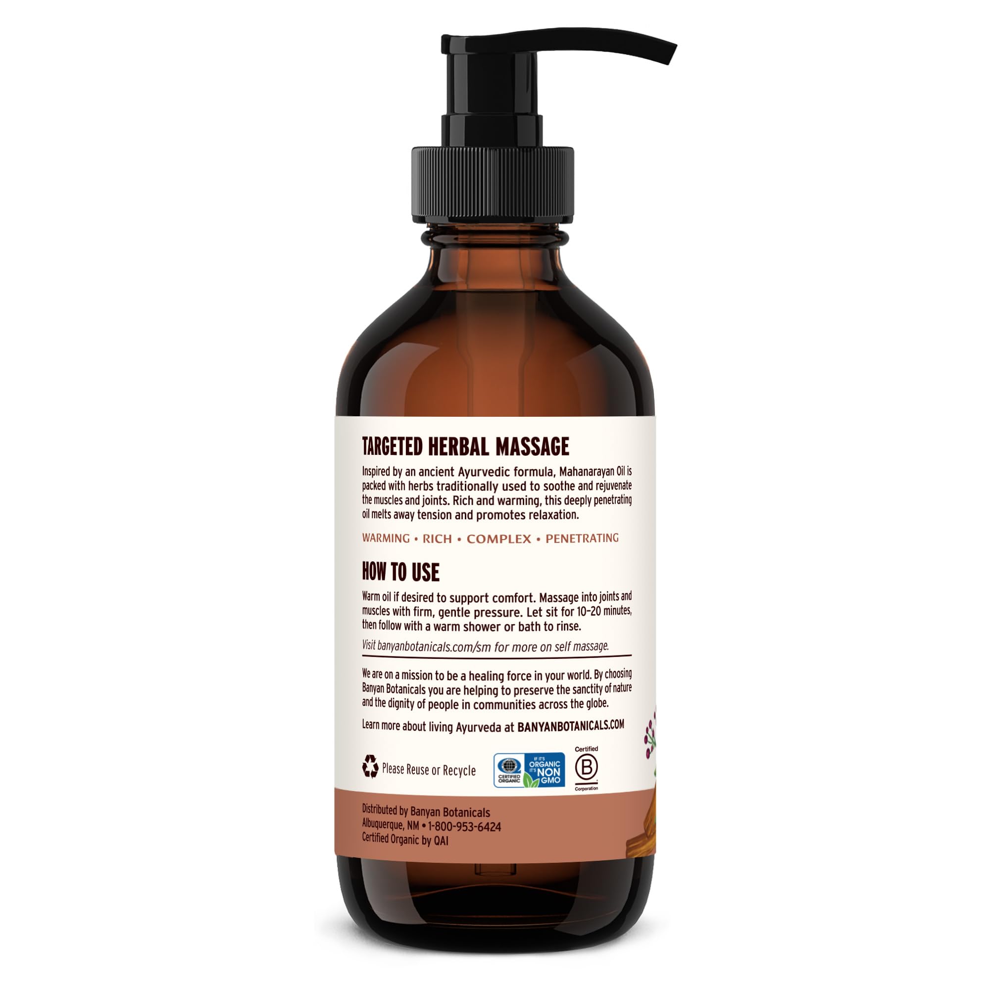 Banyan Mahanarayan Oil bottle with organic herb blend in focus.