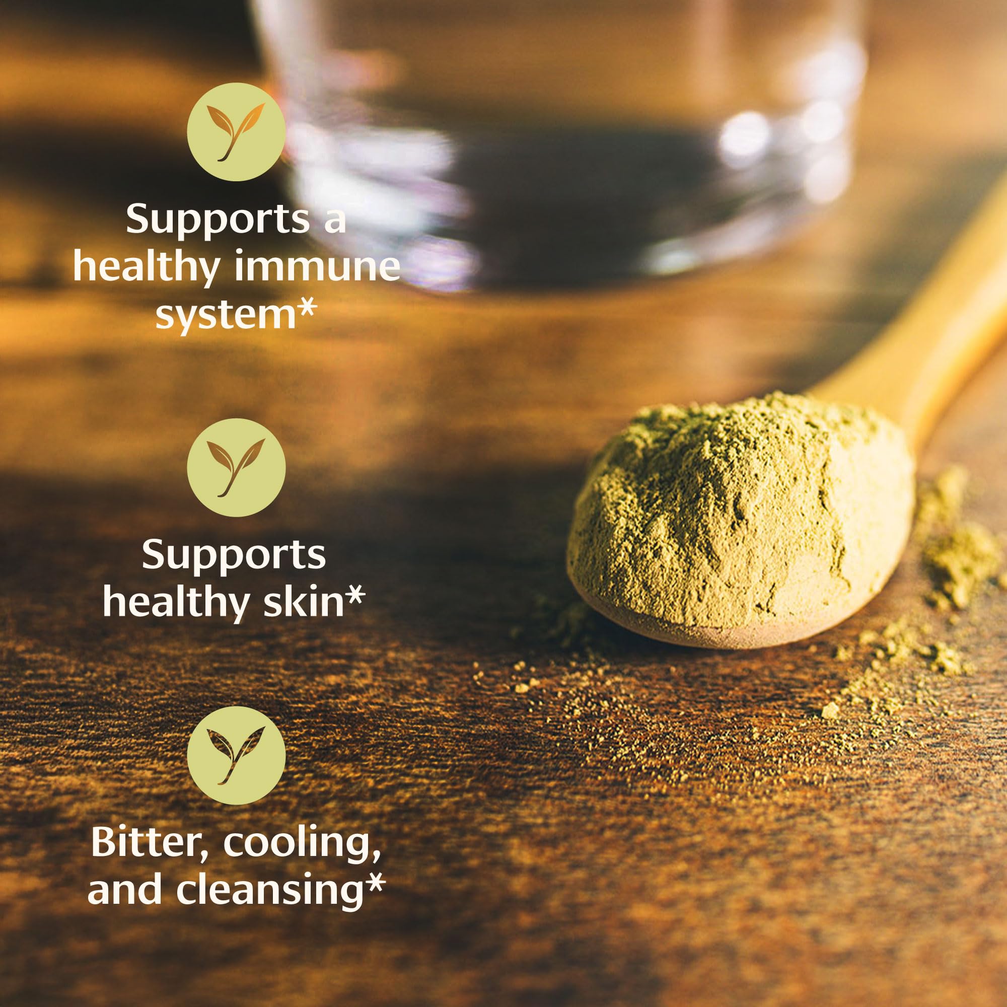 Hands blending Banyan Neem Powder into a facial mask for skincare