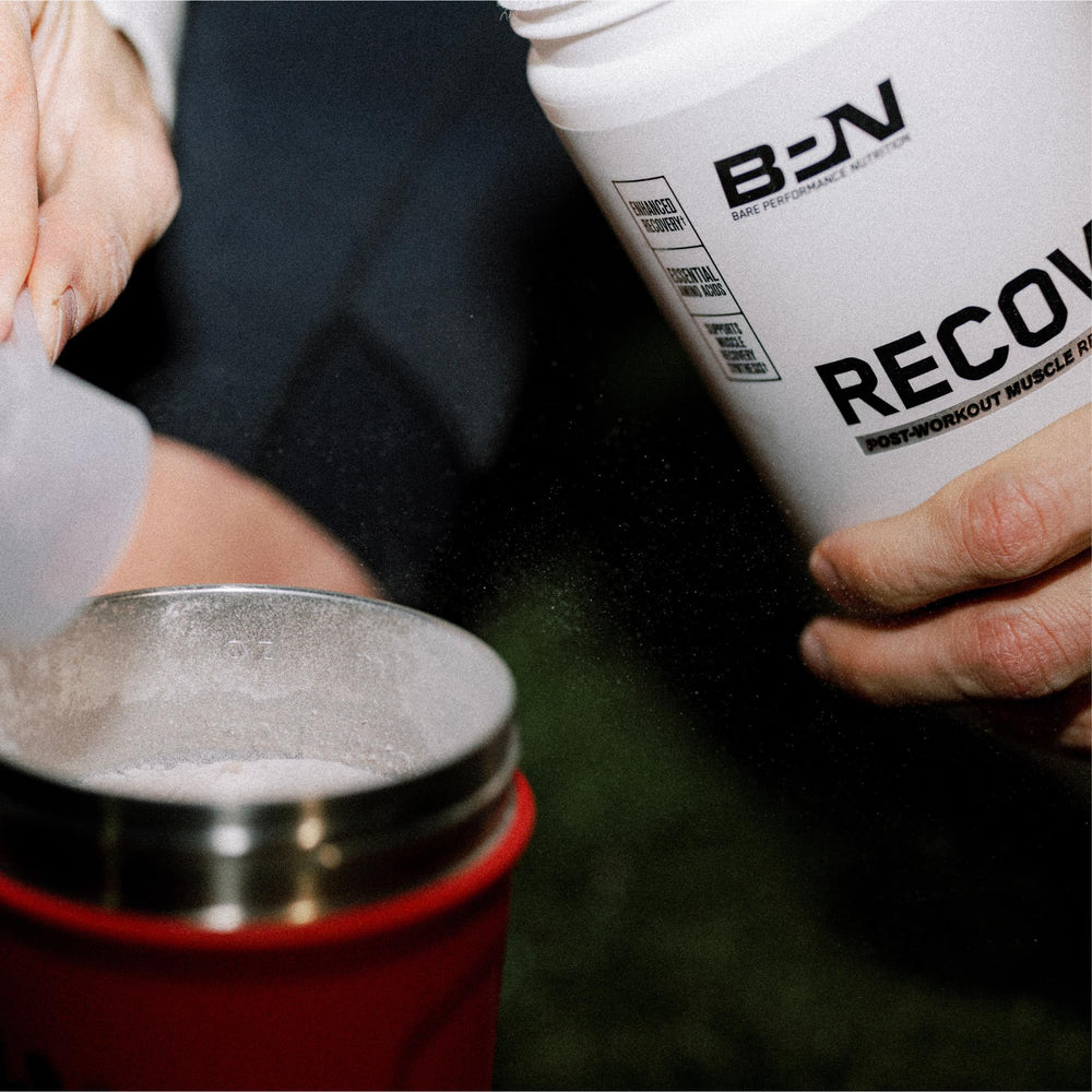 BARE PERFORMANCE NUTRITION BPN Recover Fruit Punch in glass for refreshing hydration