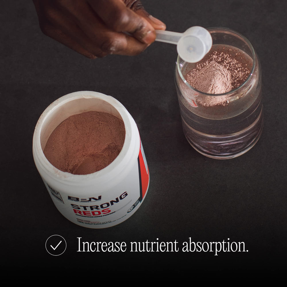 Bare Performance Nutrition Strong Reds strawberry-flavored tub closeup highlighting flavor.