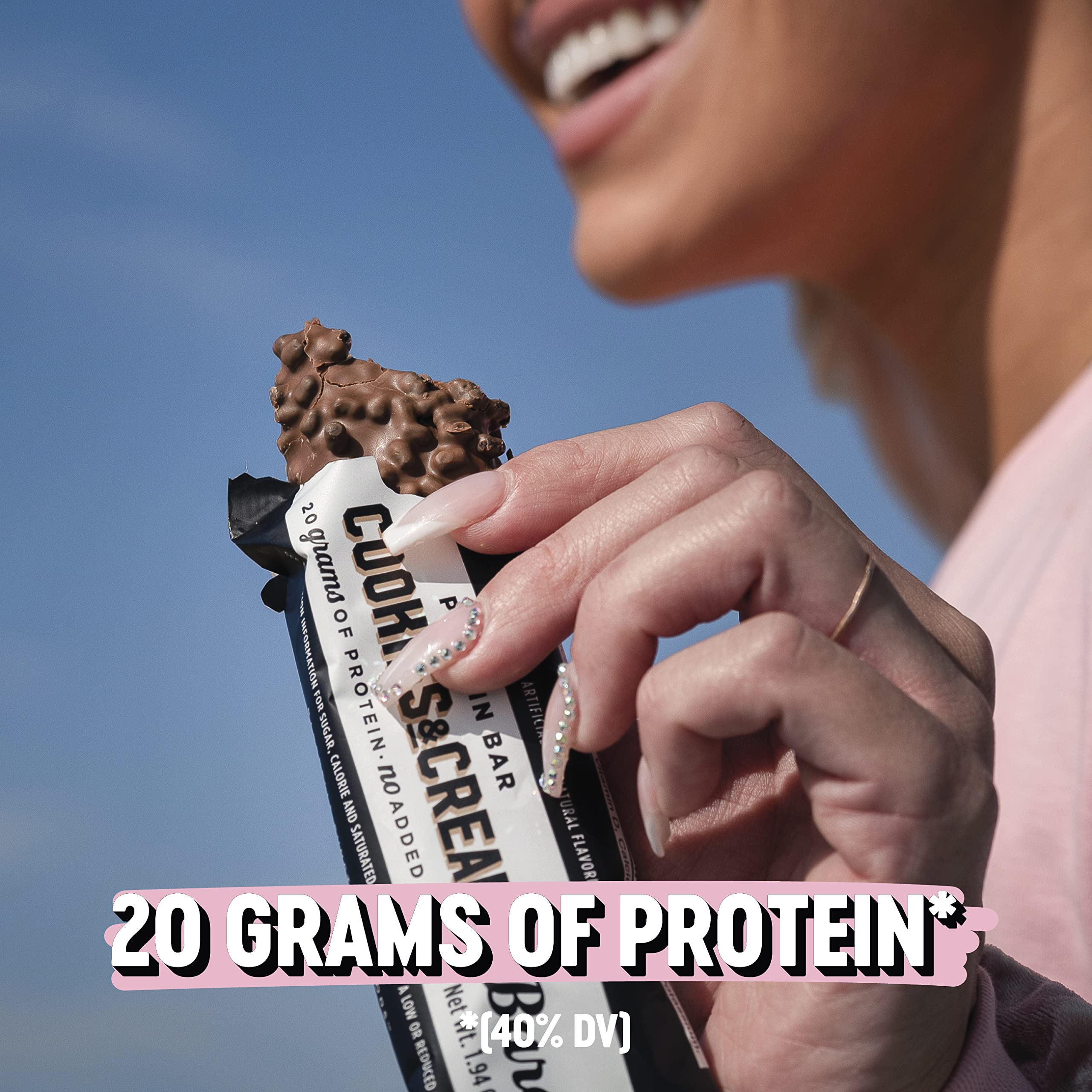 Barebells Caramel Cashew and Cookies and Cream 24-pack halved bar highlights nutty center.