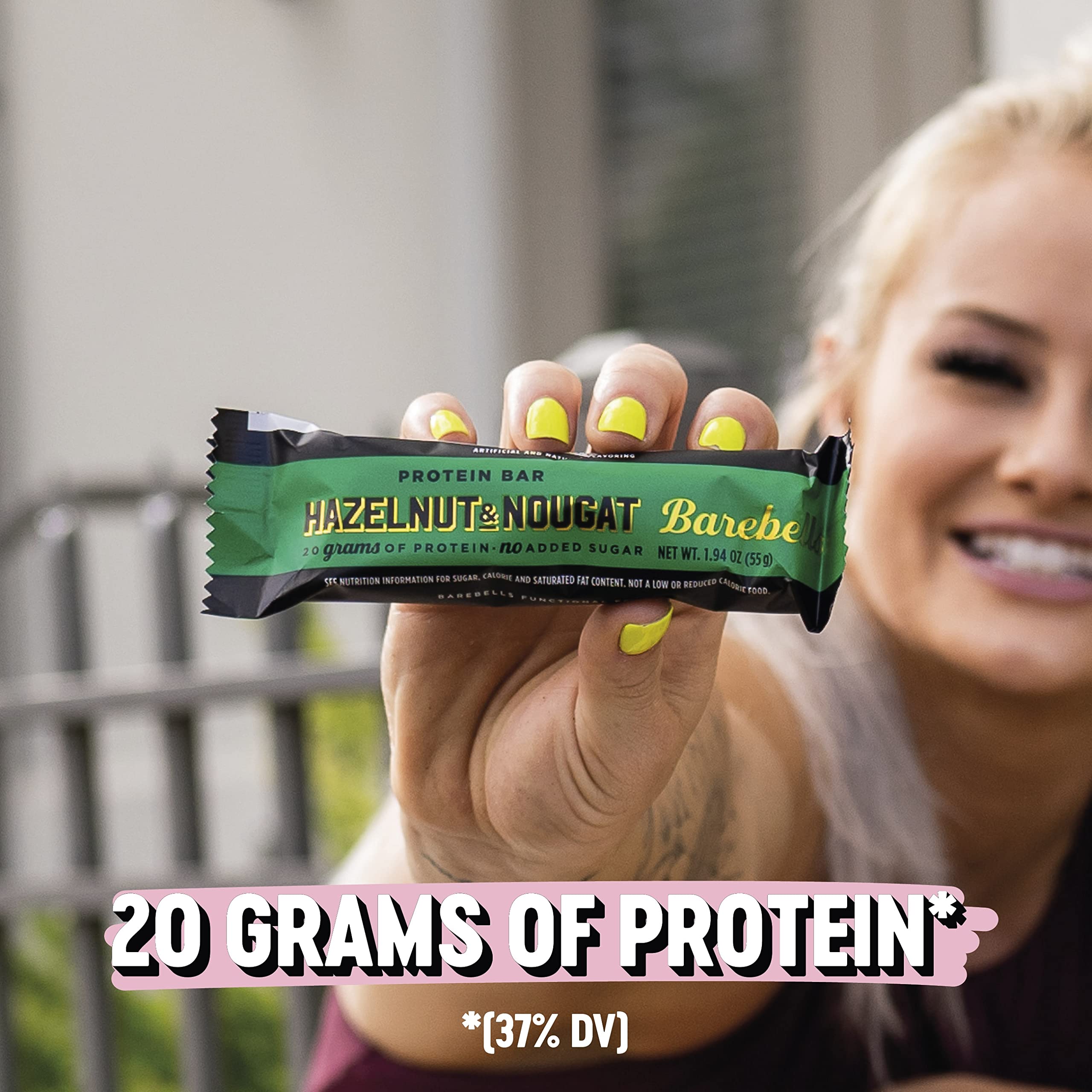 Barebells Hazelnut & Nougat bar, ingredient close-up, visible nougat bits and roasted hazelnuts.