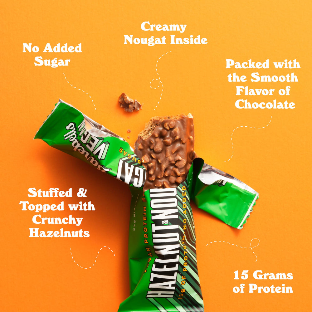 Barebells hazelnut nougat bar bite highlighting soft texture and nutty flavor.