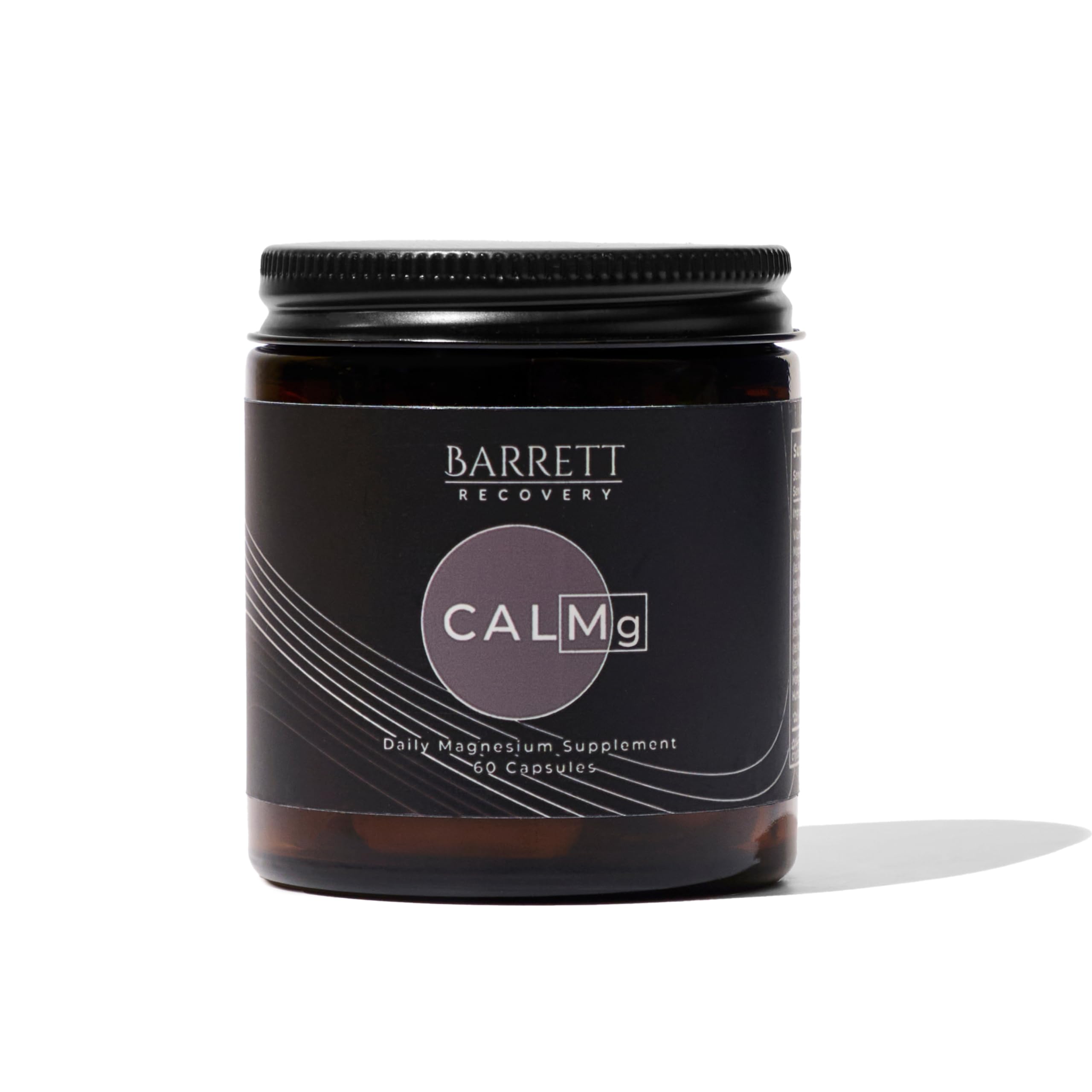 Barrett Recovery CALMg bottle on nightstand ready for calm sleep.