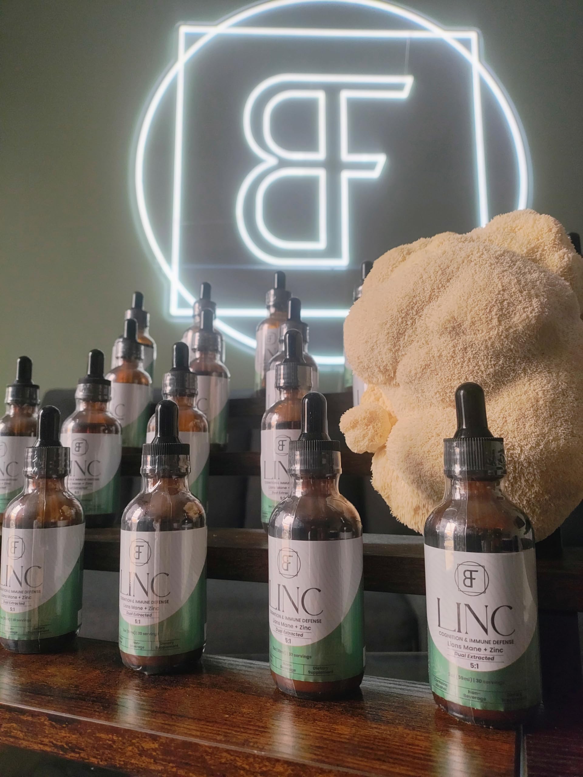 Basidia Farms LINC bottle pour showing easy dosing and daily usage.