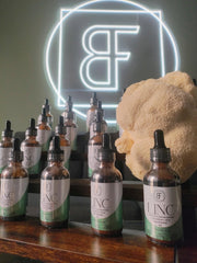 Basidia Farms LINC bottle pour showing easy dosing and daily usage.