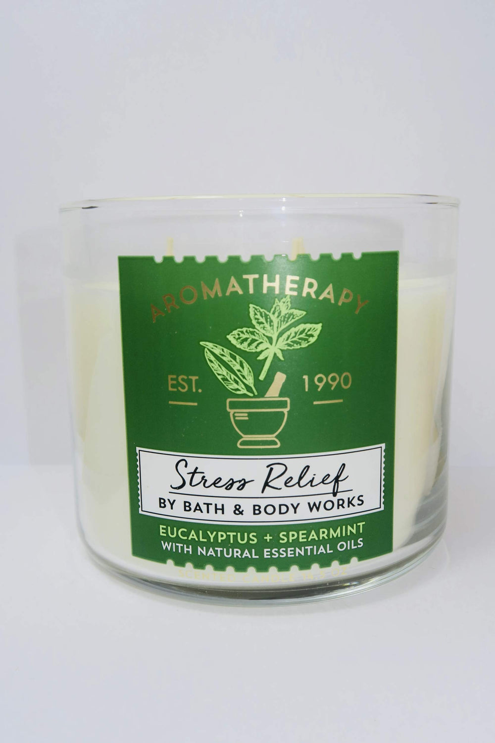 Bath and Body Works Aromatherapy Stress Relief candle with eucalyptus spearmint flame creates relaxing atmosphere.