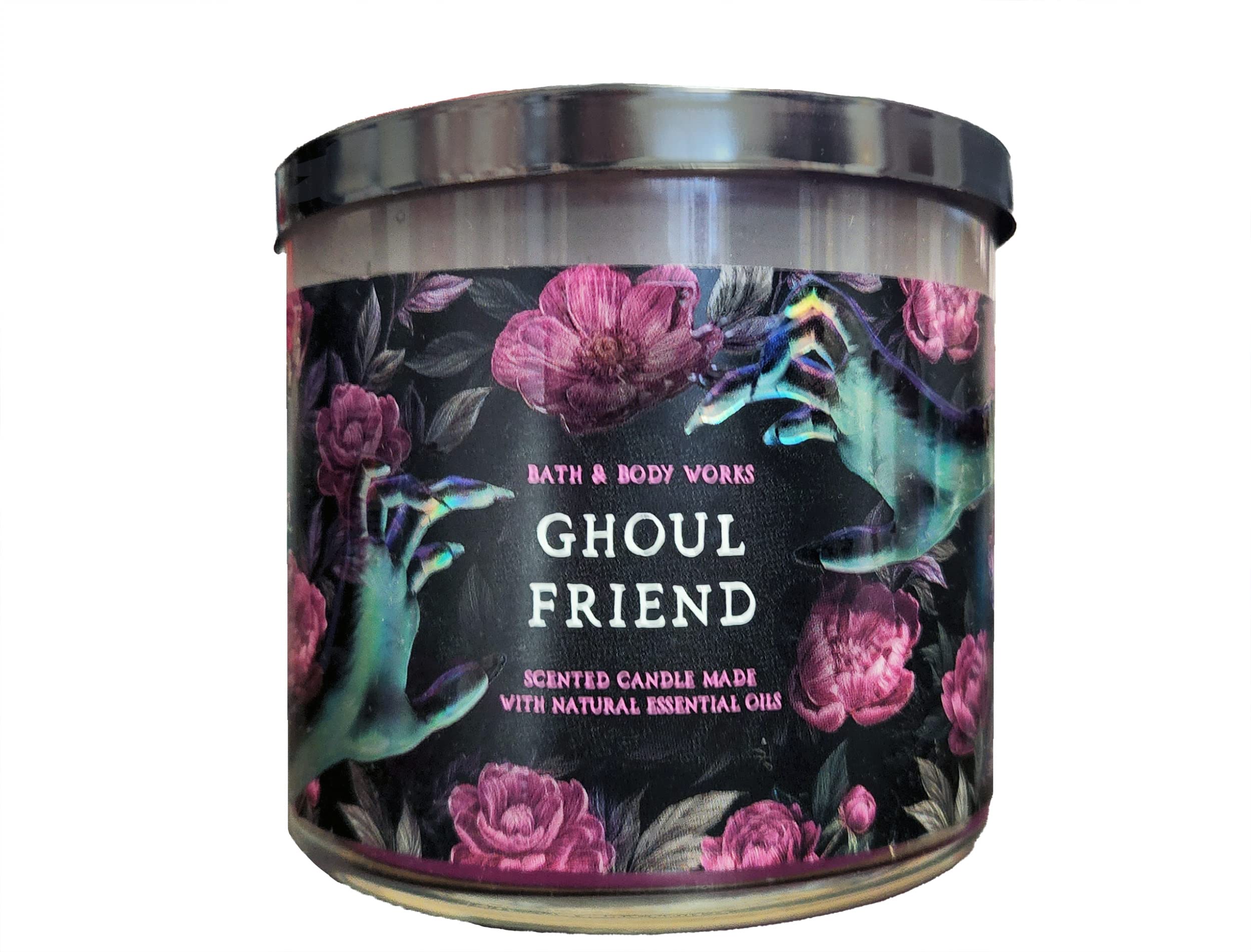 Bath & Body Works Ghoul Friend candle lit in Halloween setting for seasonal charm.