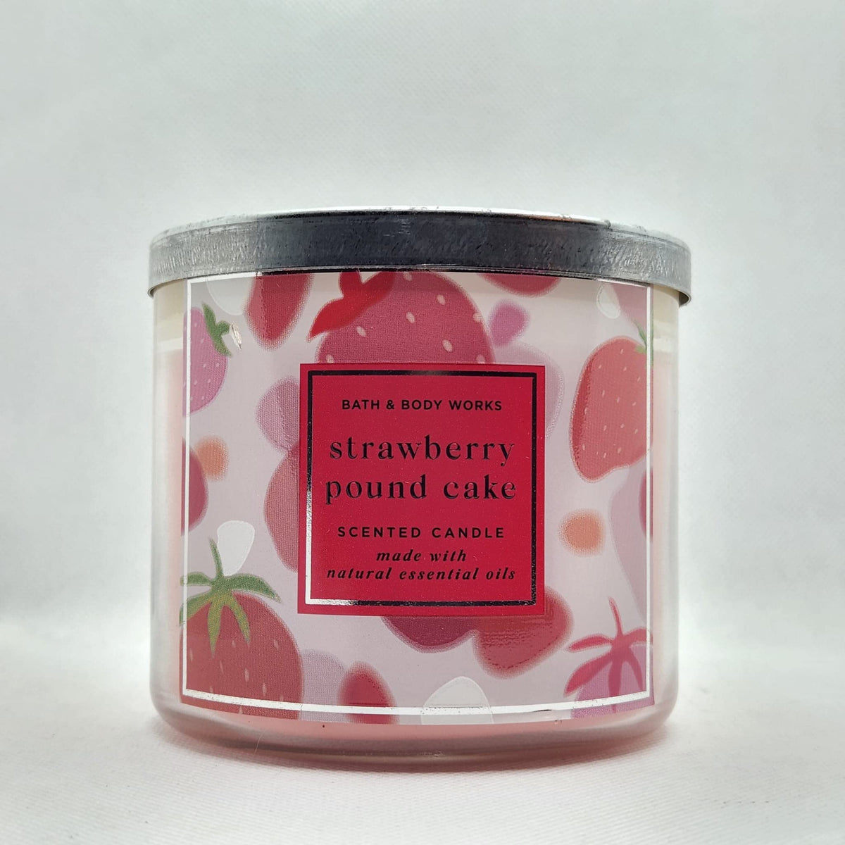 Bath & Body Works White Barn Strawberry Pound Cake candle, 3-wick, lasting spring fragrance for cozy spaces.