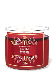 Bath & Body Works White Barn 3-Wick Candle jar glow for warm holiday ambience.