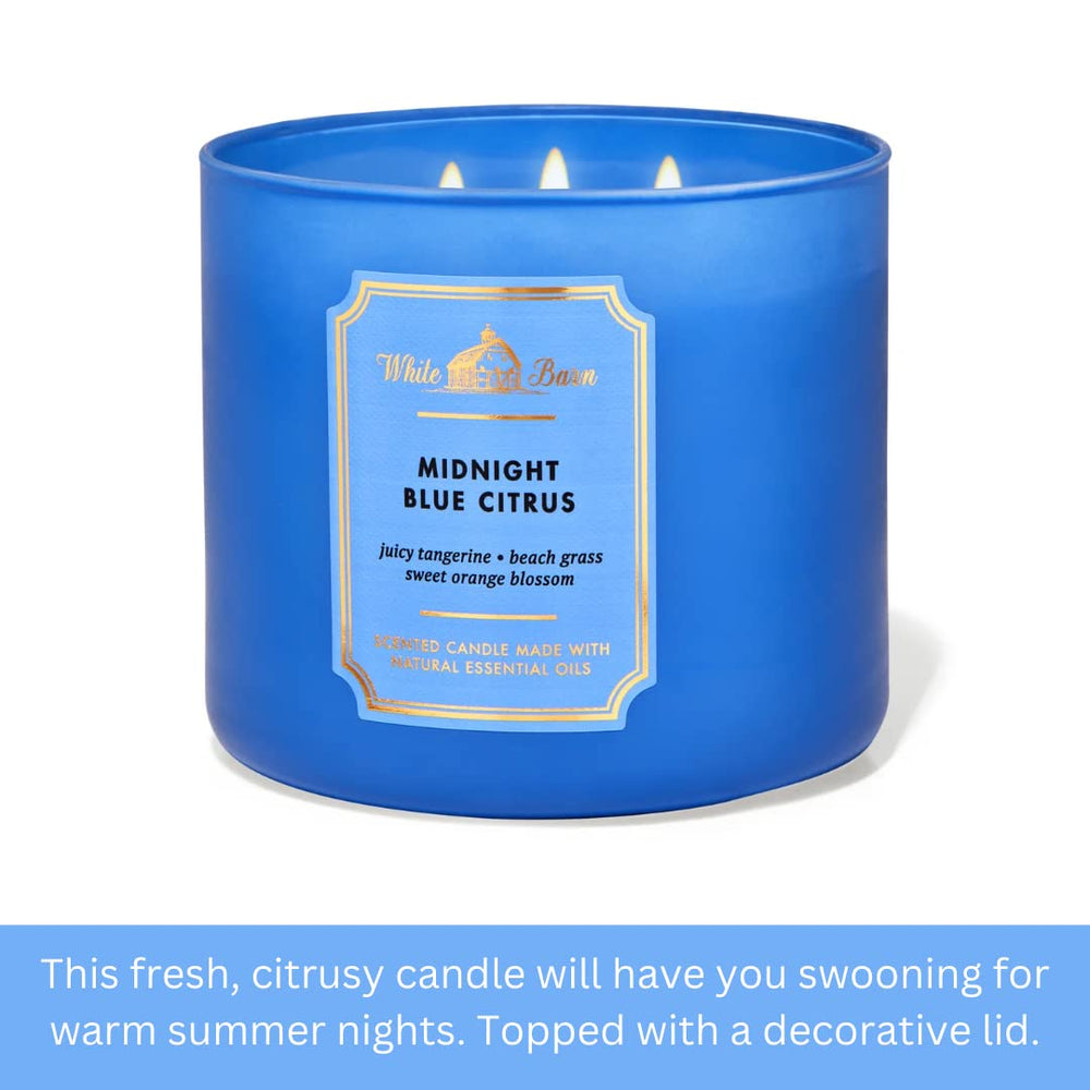 Bath and Body Works White Barn 3-Wick Candle Midnight Blue Citrus glass container complements decor.