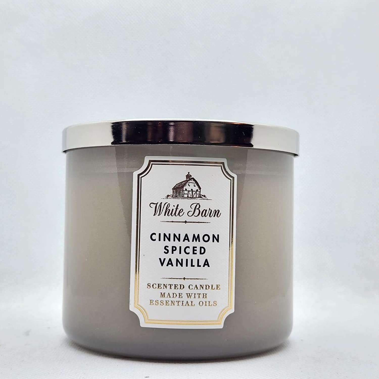 Bath & Body Works Cinnamon Spiced Vanilla candle with 3-Wick setup for a cozy living room ambiance.
