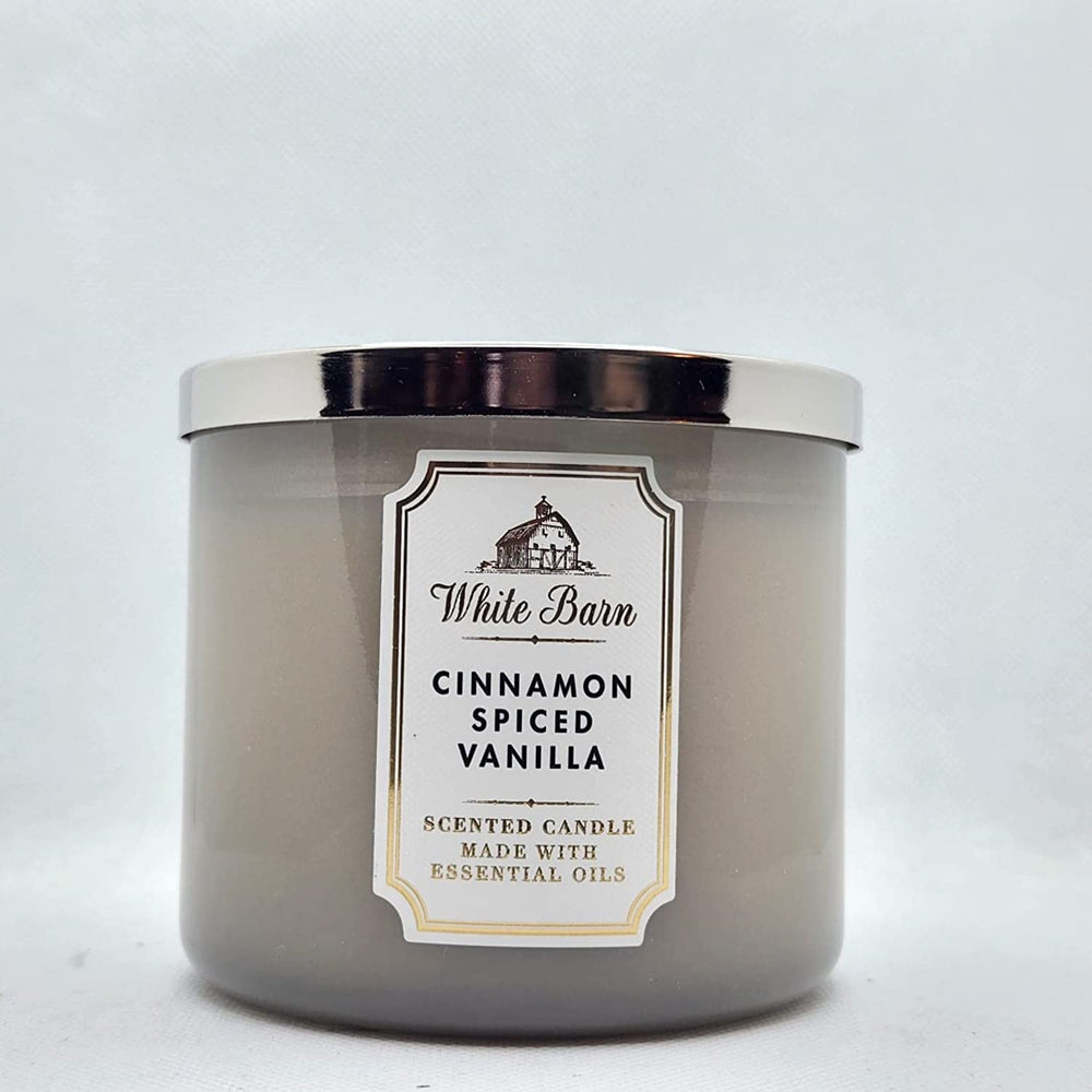Bath & Body Works Cinnamon Spiced Vanilla candle with 3-Wick setup for a cozy living room ambiance.