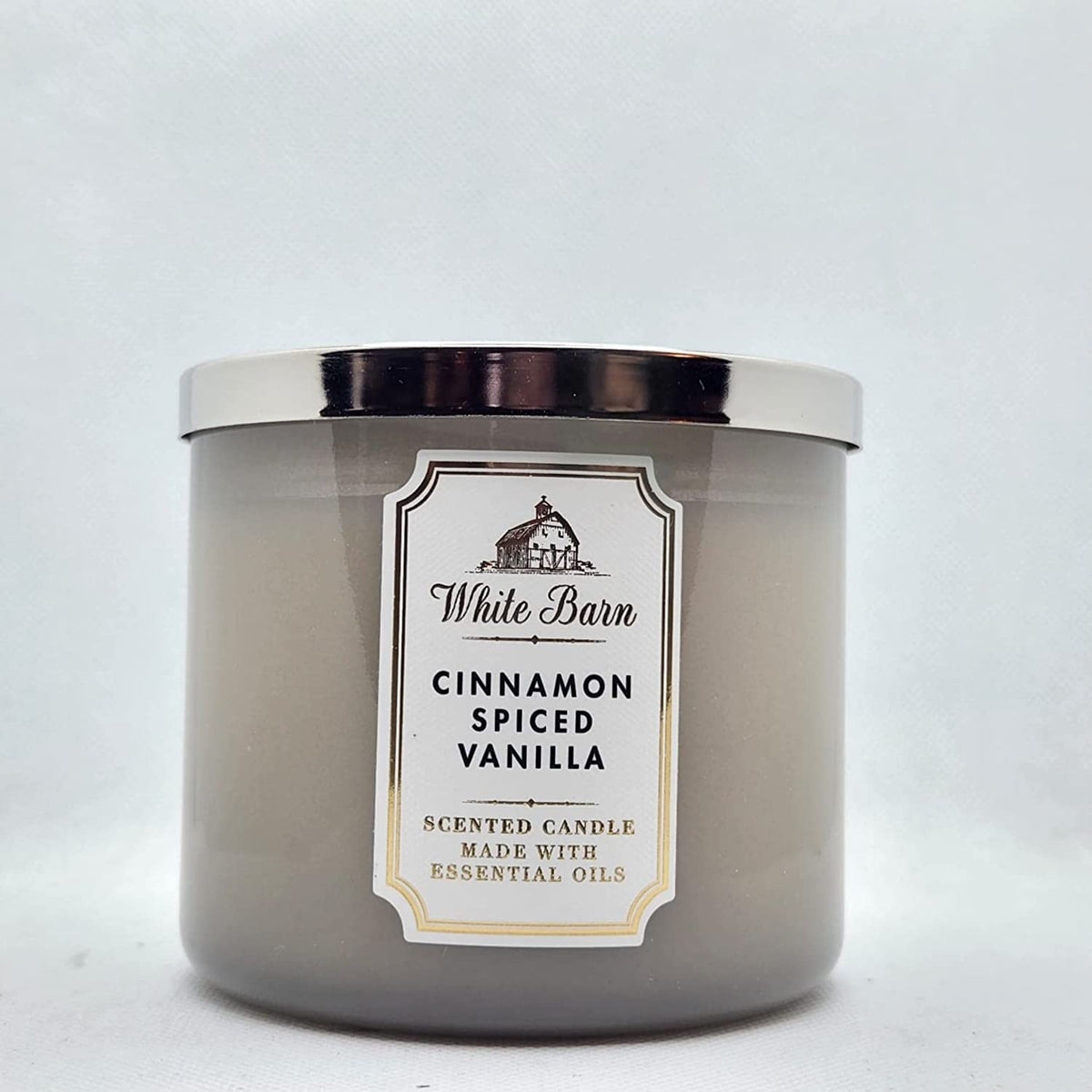 Bath & Body Works Cinnamon Spiced Vanilla candle with 3-Wick setup for a cozy living room ambiance.